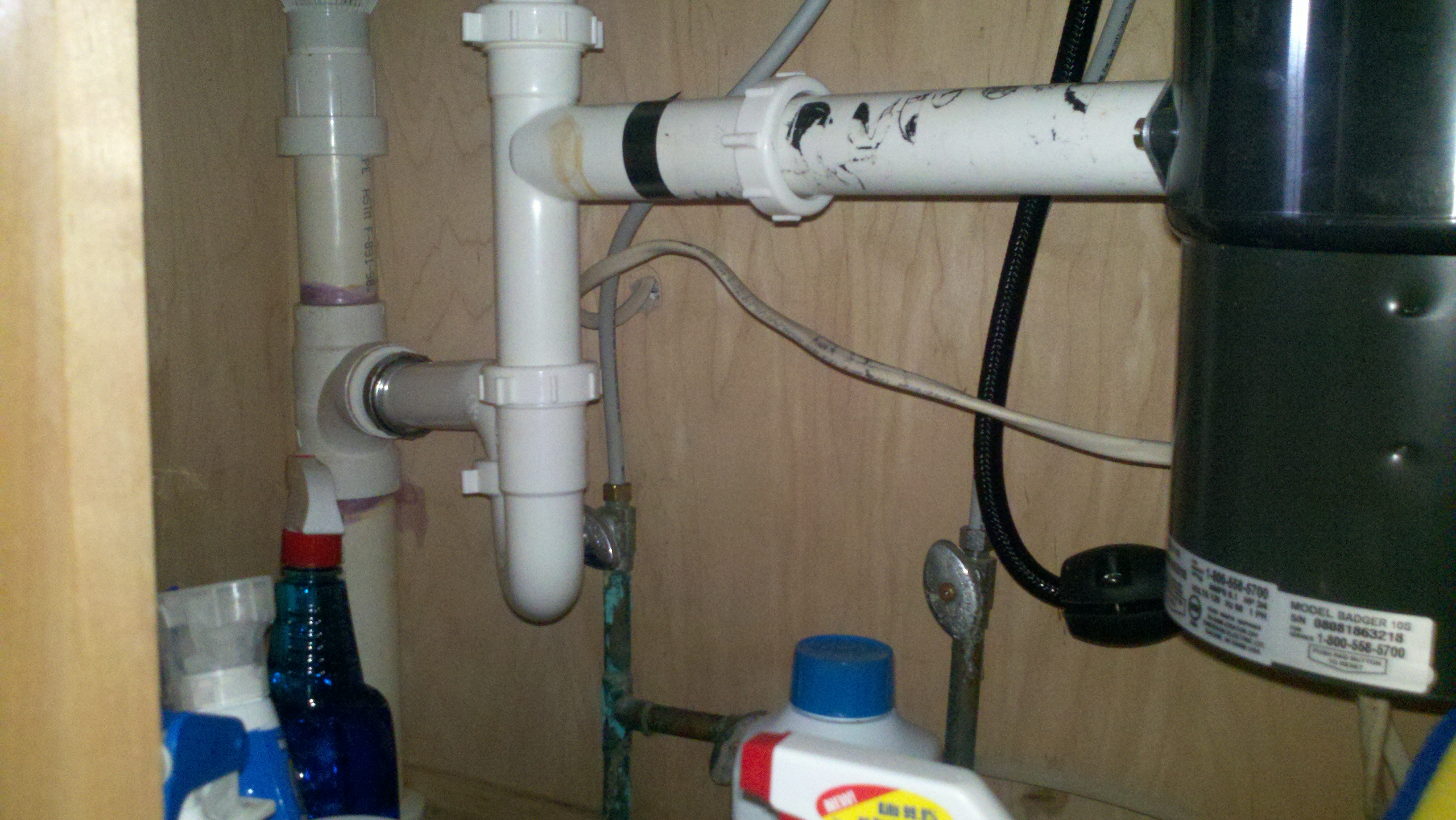fix plumbing under kitchen sink